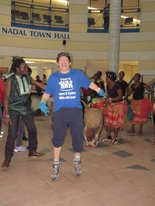 Man dancing while band plays music