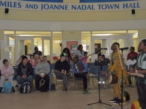 Band playing for a crowd of people.