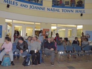 Spectators watching a band at the town hall
